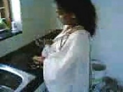 Indian Wife In Kitchen