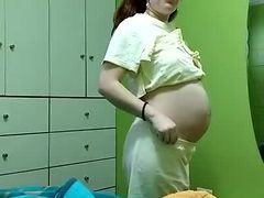 Sexy Pregnant Woman Getting Dressed
